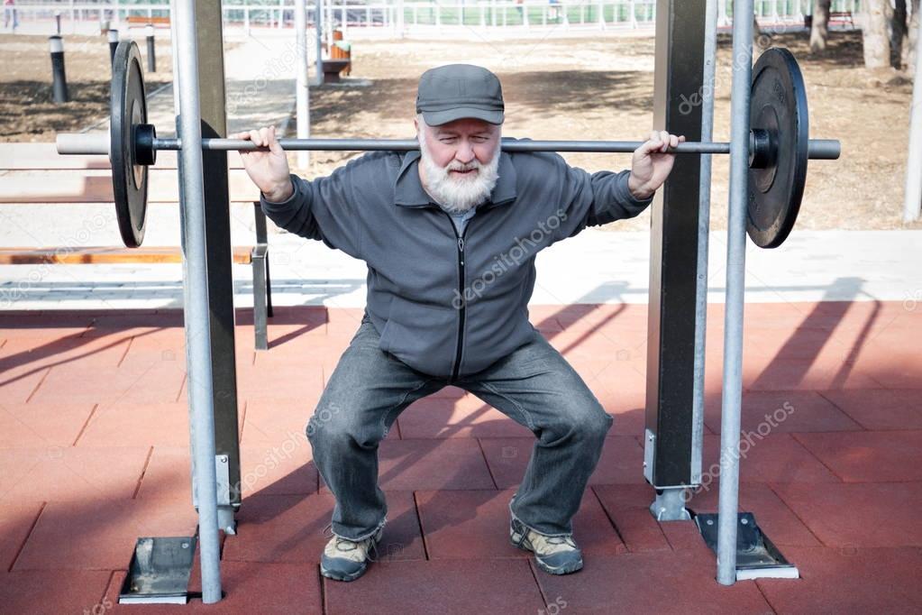 Old man doing fitness