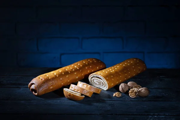 Sweet bread with walnuts on wooden table — ストック写真