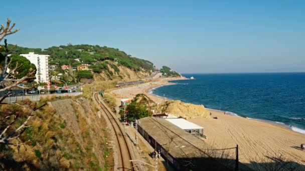 SAN POL DE MAR,BARCELONA, SPAIN - FEBRUARY 23, 2020: Tourist town on the coast in a passing train — Stock Video