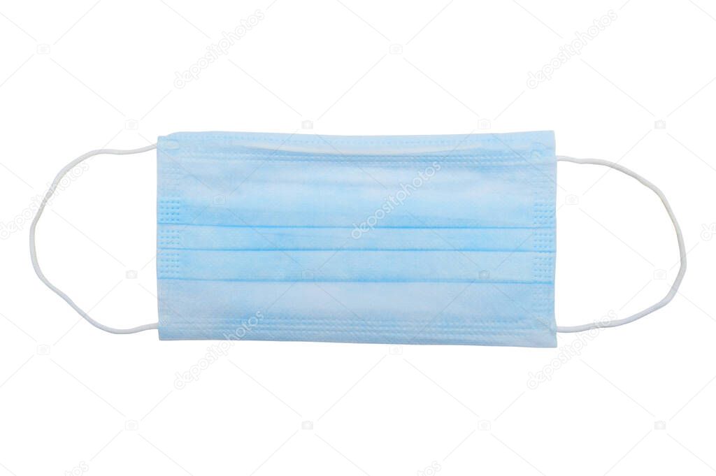 Top view of one surgical disposable face mask PP 3-ply with earloop isolated on white background - used in COVID-19 global pandemic of coronavirus SARS-CoV-2