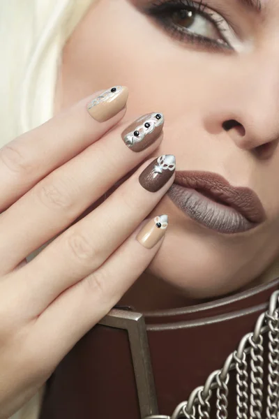 Makeup and manicure brown chain.