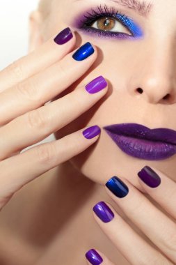 Blue purple fashion multicolored manicure and makeup. clipart