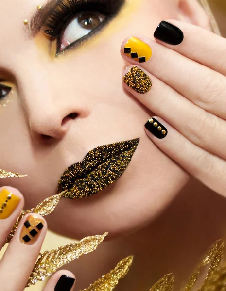 Festive yellow black manicure and makeup . — Stock Photo, Image