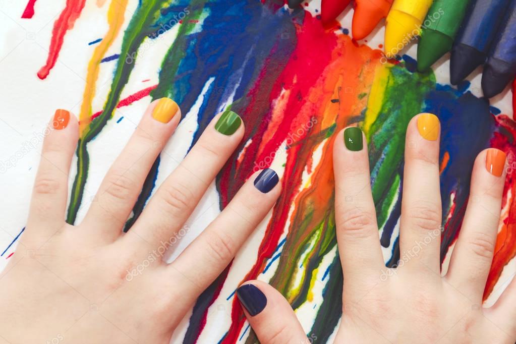 Mixed rainbow children's manicure and drawing.