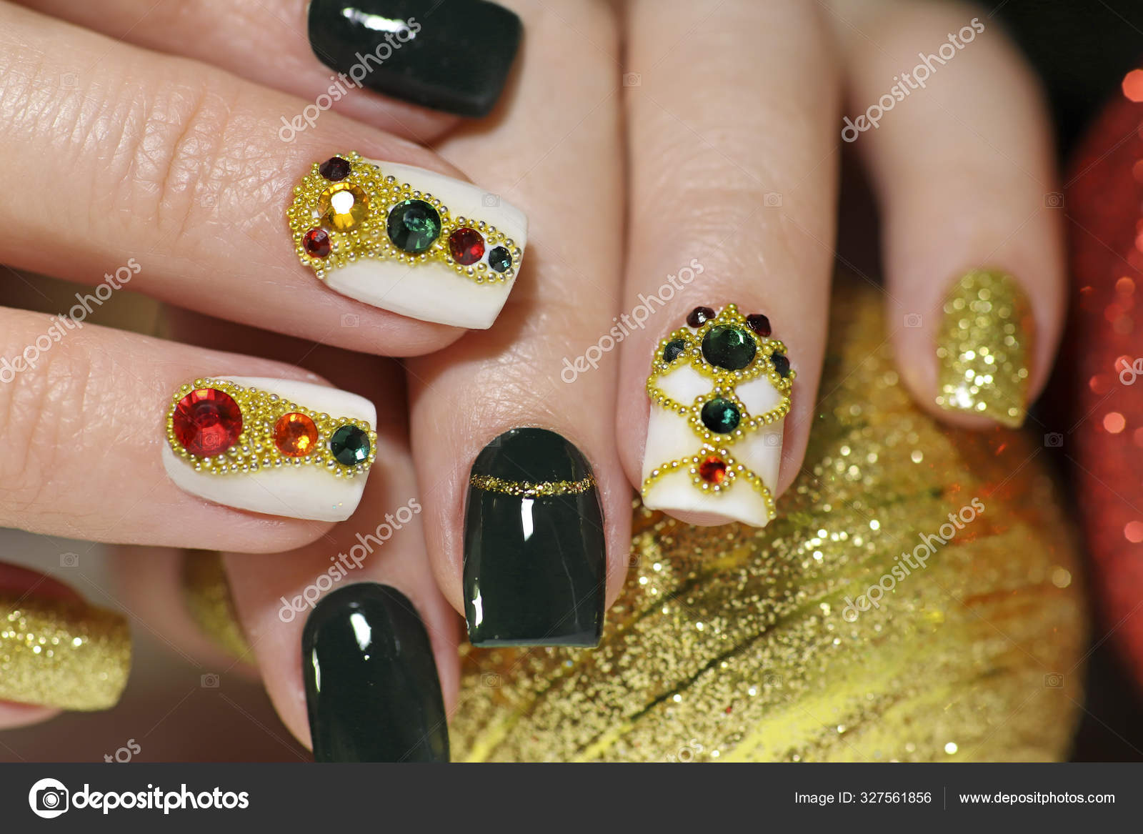 Premium Photo | A green and gold nail art design with gold leaves