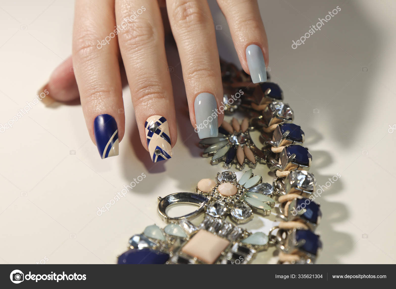 Graphic Nail Design Beige Transparent Blue Dark Matte Blue Nail Stock Photo by ©marigo 335621304 Graphic Nail Design Beige Transparent Blue Dark Matte Blue Nail Stock Photo by ©marigo 335621304