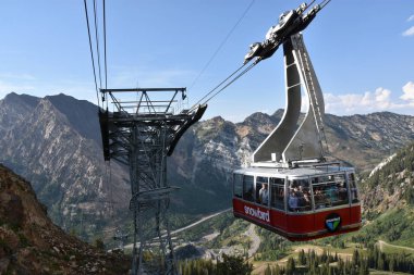 SANDY, UT - AUG 29: Aerial Tram at Snowbird Resort in Sandy, Utah, as seen on Aug 29, 2017. It whisks passengers along a 1.6 mile cable and up 2,900 vertical feet during the 10-minute trip to the top. clipart
