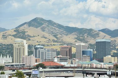 SALT LAKE CITY, UT - AUG 30: View of Salt Lake City in Utah, as seen on Aug 30, 2017. The city is bordered by the buoyant waters of the Great Salt Lake and the snow-capped peaks of the Wasatch Range. clipart