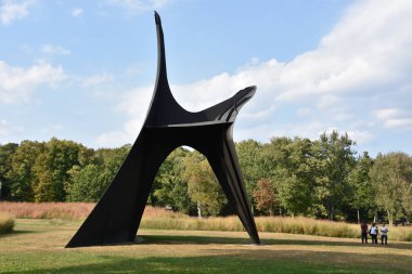 NEW WINDSOR, NY - SEP 22: The Arch by Alexander Calder at the Storm King Art Center in New Windsor, New York on Sep 22, 2019. Its perhaps the largest collection of contemporary outdoor sculptures in US. clipart