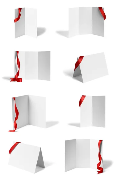 Přeložená letka červená páska luk papír předloha kniha pracovní plocha kalendář — Stock fotografie