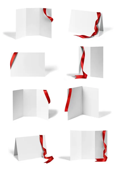 折叠传单红丝带弓纸模板书桌面卷 — 图库照片