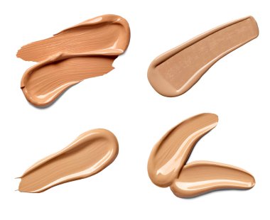 Güzellik sıvısı tozu koleksiyonu beyaz arka planda makyaj darbeleri. Her biri ayrı ayrı çekiliyor.