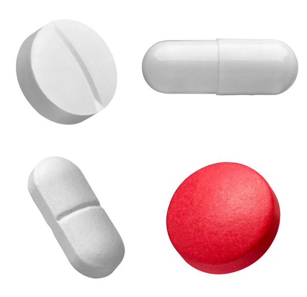 白を背景に様々な白と赤の錠剤を集め — ストック写真