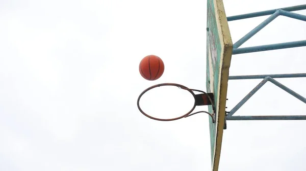 sport old hoop basketball bottom view outdoors rusty iron ball enters the basket