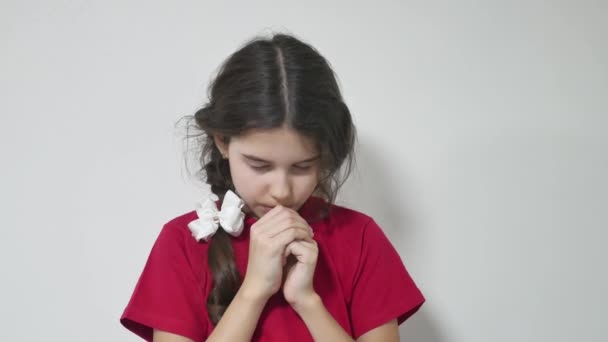 Girl Kid Praying On A White Background Girl Teen Religion Stock Video Girl Kid Praying On A White Background Girl Teen Religion Stock Video