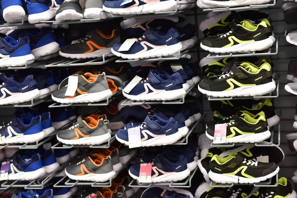 Sneakers in a sports shop on sale — Stock Photo, Image