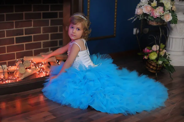 Girl Blue Dress Glowing Fireplace Christmas — Stock Photo, Image