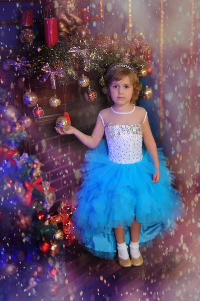 Girl in white with blue dress at the Christmas — Stock Photo, Image