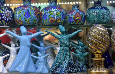 Close-up of ceramic statuettes of whirling dervishes  at a Turki clipart