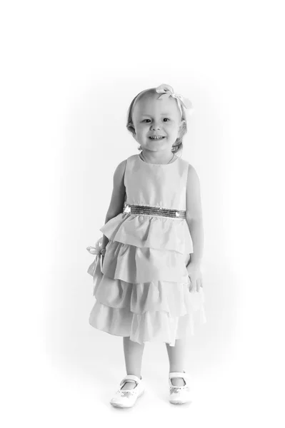 Meisje in een jurk op een witte achtergrond, vintage foto — Stockfoto