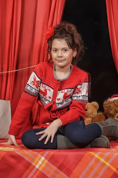 Brunette girl in a red sweater — Stock Photo, Image