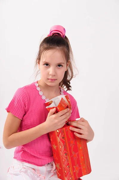 Girl in pink in the studio with a huge candy — Stock Photo, Image