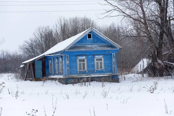 Wooden house in a small village in winter — 스톡 사진