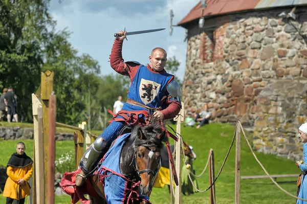 A knight with a spear on a horse at the Russian Fortress festiva — Stock Photo, Image