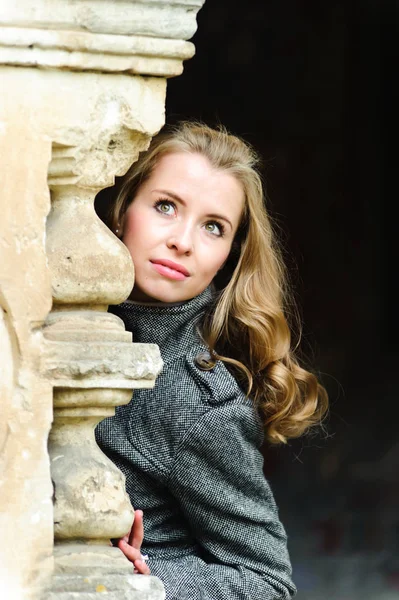 Beautiful girl in a gray coat — Stock Photo, Image