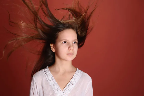 Brunette Child Girl Studio Red Background Flying Hair — Stock Photo, Image