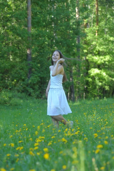 Young Brunette Girl White Blouse Skirt Clearing Dandelions — Stock Photo, Image