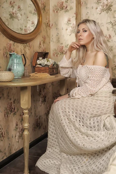 Sexy Beautiful Blonde White Knitted Sweater Sits Table Wrapping His — Stock Photo, Image