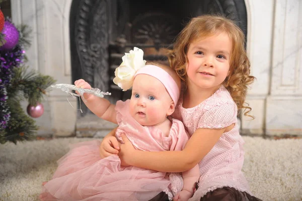 Happy Little Girl Dress Her Newborn Sister — Stock Photo, Image