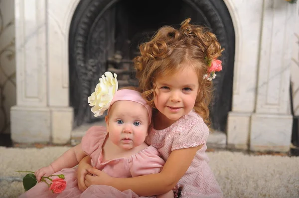 Happy Little Girl Dress Her Newborn Sister — Stock Photo, Image