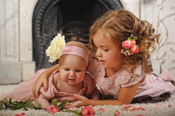 Happy Little Girl Dress Her Newborn Sister — Stock Photo, Image