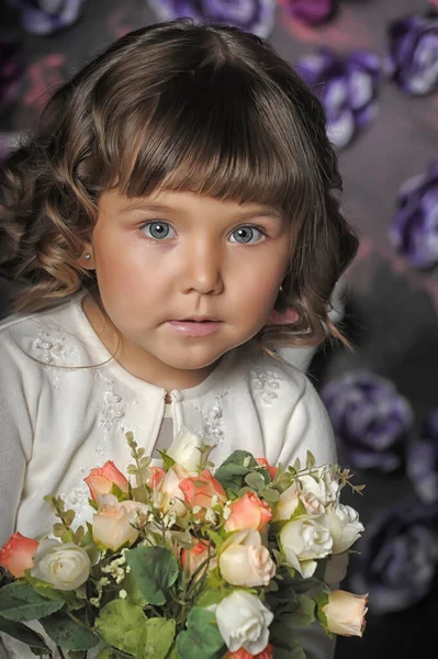 Little Brunette Girl Curls White Sweater Flowers Her Hands Floral — Stock Photo, Image