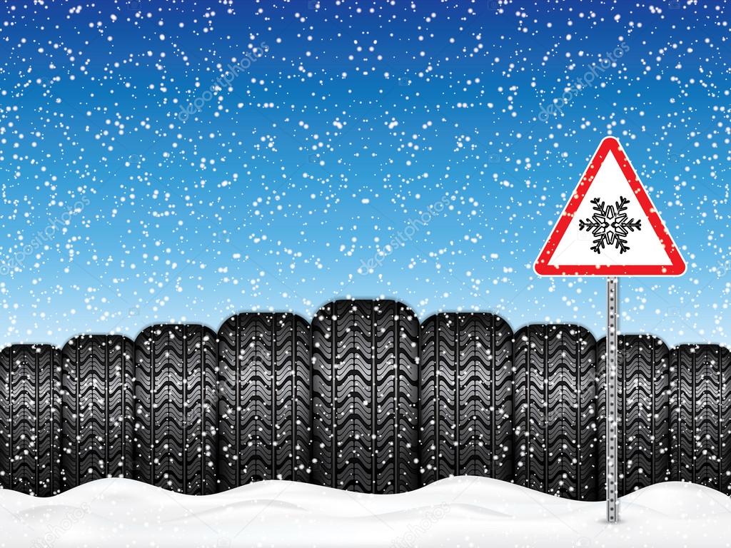 Winter car tires and triangle road sign