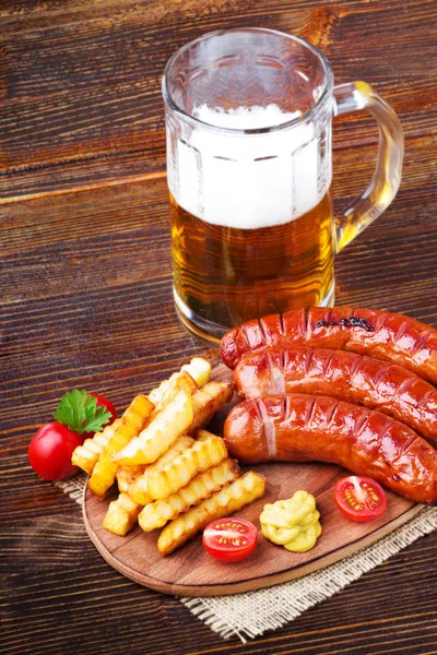 Grilled sausages with french fries — Stock Photo, Image