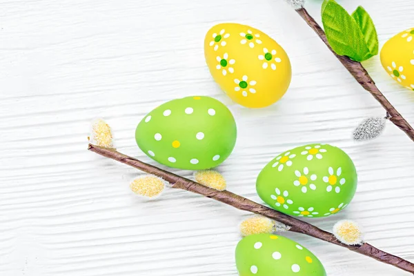 Easter eggs and willow branches — Stock Photo, Image