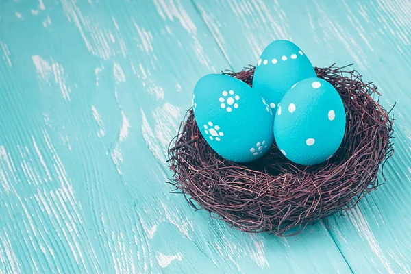 Blue Easter eggs in nest — Stock Photo, Image