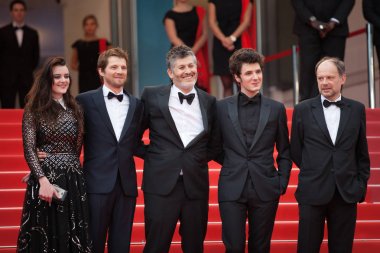 CANNES, FRANCE - MAY 10, 2018: Denis Podalydes, Vincent Lacoste, Christophe Honore, Pierre Deladonchamps and Adele Wismes attend screening of 'Sorry Angel (Plaire, Aimer Et Courir Vite)' during the 71st annual Cannes Film Festival clipart