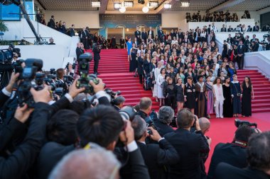 CANNES, FRANCE - MAY 12, 2018:  Film representatives pose on the red carpet at the screening of 'Girls Of The Sun (Les Filles Du Soleil)' during the 71st annual Cannes film festival clipart