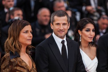 CANNES, FRANCE - MAY 13, 2018: Marina Fois, Guillaume Canet, Leila Bekhti attending screening of 'Sink Or Swim (Le Grand Bain)' during the 71st annual Cannes Film Festival clipart