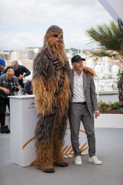 CANNES, FRANCE - MAY 15, 2018: Chewbacca and Ron Howard attend 'Solo: A Star Wars Story' Photocall during the 71st annual Cannes Film Festival clipart