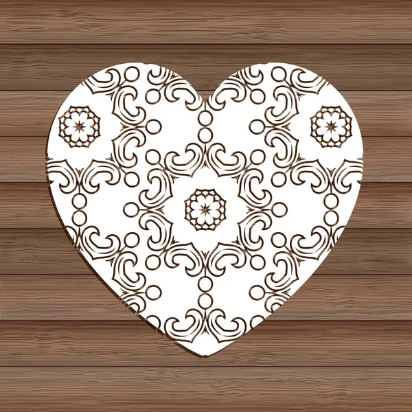 Decorative cutout heart on wooden texture — 스톡 벡터