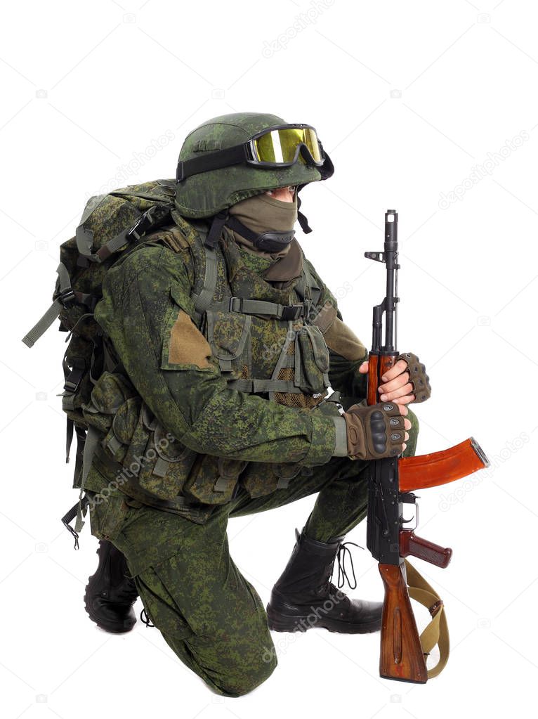 Soldier with rifle on a white background