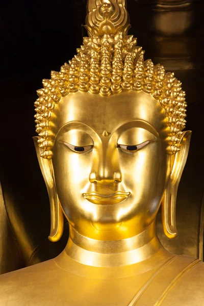 Golden Buddhist statue face — Stock Photo, Image