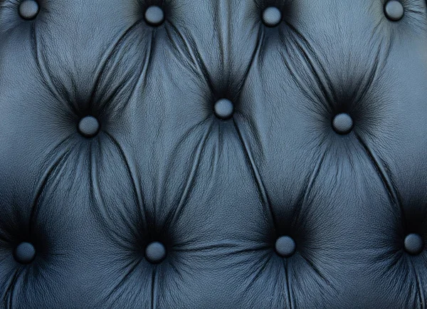 Black genuine leather sofa pattern — Stock Photo, Image