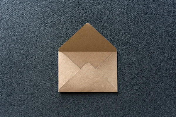 Kraft Envelope on a Dark Background. Minimalism.