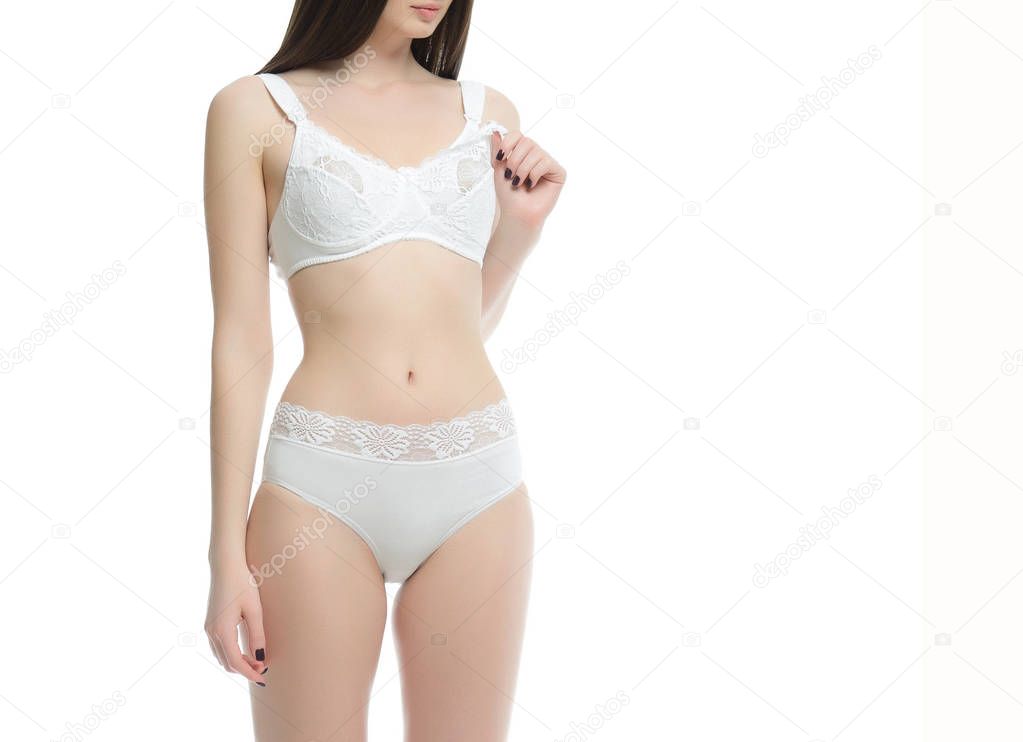 Figure of a pregnant woman in lingerie for feeding, panties and bra on a white background.